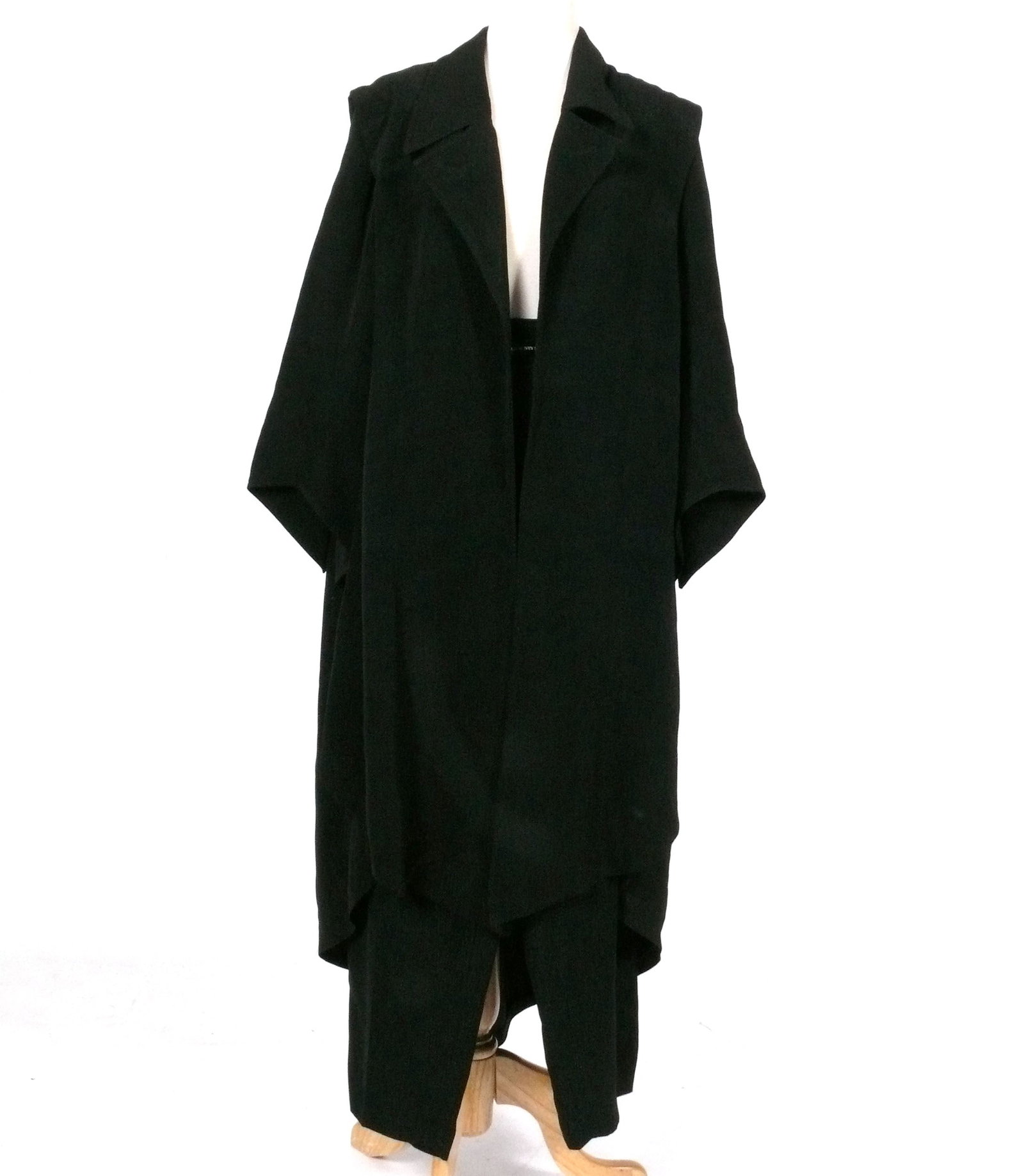 Vintage William Ivey Long Women's Coat and Pants Set: An oversized coat and pants set in a shimmery black fabric by designer William Ivey Long. The coat measures 19" across from shoulder to shoulder, and an overall length of 44" from shoulder to hem. The
