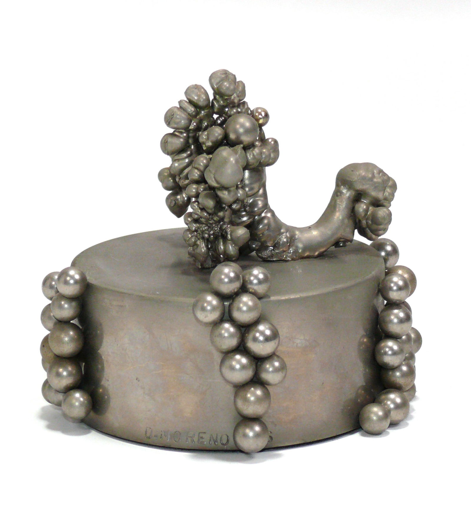 Dolly Moreno Kinetic Abstract Sculpture in Stainless Steel: Kinetic Abstract Sculpture, hand made by Dolly Moreno, American, circa 1960s. Signed on base. It is on a magnetic base, and some of the elements of the sculpture can be moved. 4.5"H x 5"W x 5"D. The M