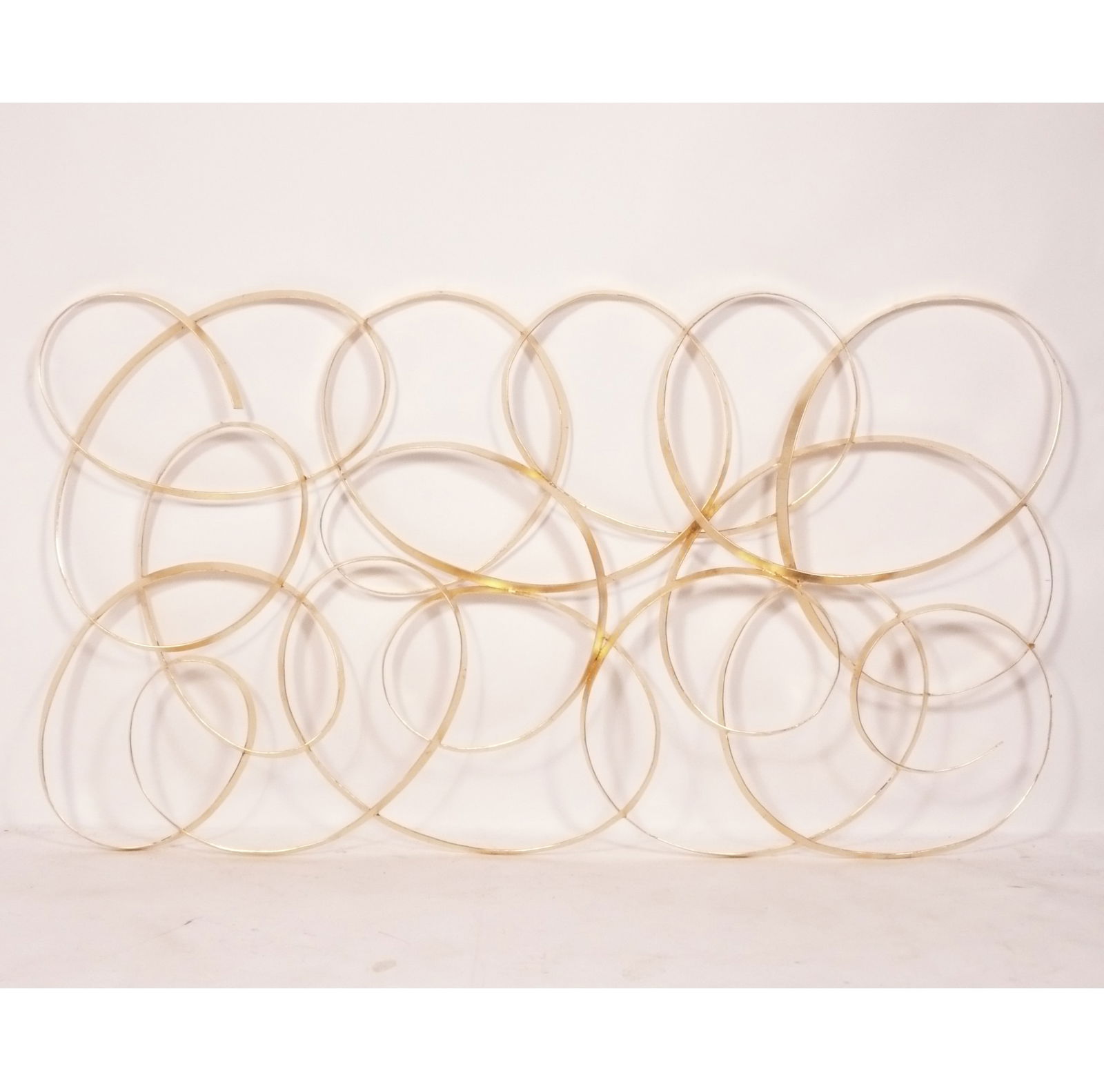 Large Scale Gilt Metal Mid Century Wall Sculpture 70" x 40" attributed to William Bowie: Large Scale Gilt Metal Mid Century Wall Sculpture, attributed to William Bowie, unsigned, circa 1960s. It measures an impressive 70.75"W x 39.5H x 1.5"D. The Museum Auctions does not provide in house