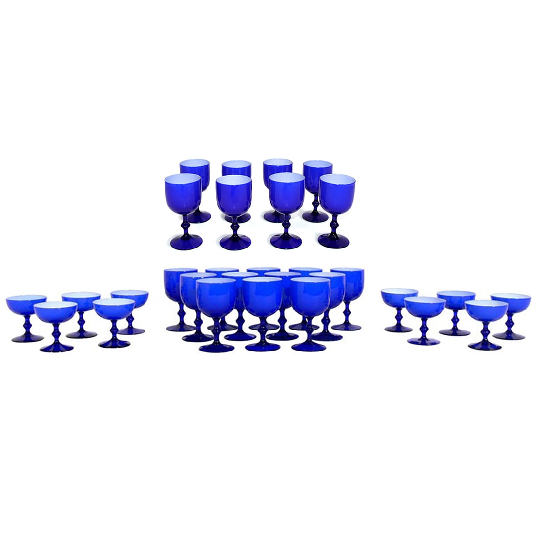 Cobalt Blue Carlo Moretti for Empoli Italian Glasses 30 pieces 20 Large 10 Smaller: Vibrant set of cobalt blue glasses, designed by Carlo Moretti for Empoli, Italy, circa 1950s. The set consists of 30 glasses, 20 larger glasses measuring 5.75" H x 3.25" W each and 10 smaller glasses