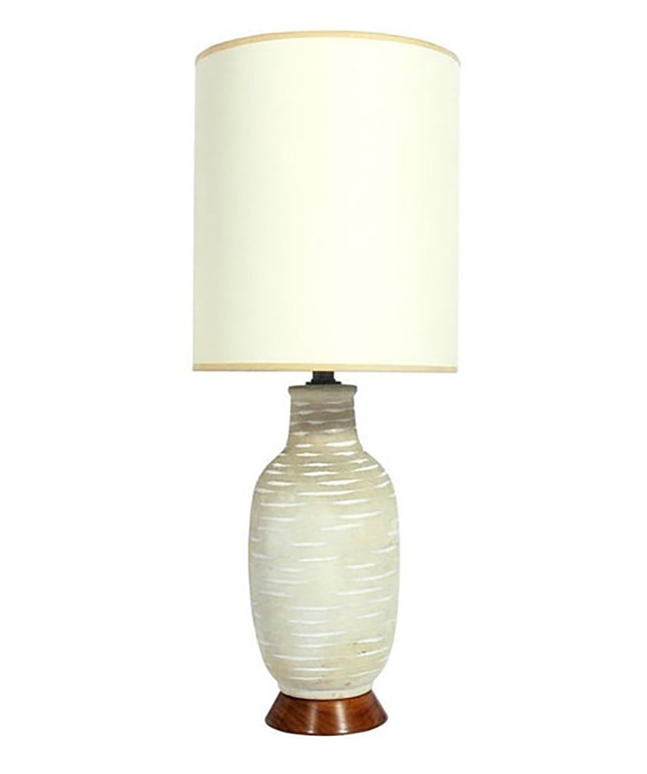 Mid Century Design Technics Ceramic Lamp: American, circa 1960s. The lamp measures 20"H to the top of the socket. The base measures 6"W. The shade is not included. The Museum Auctions does not provide in house shipping for any items. We have