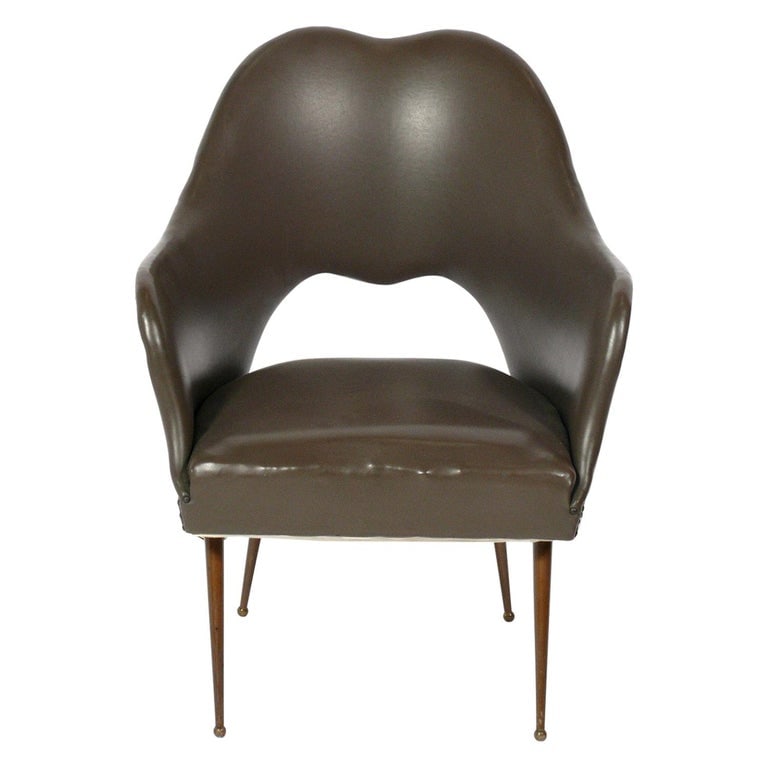 Curvaceous Italian Mid Century Lounge Chair: Curvaceous Italian mid century lounge chair, Italy, circa 1950s. It is a versatile size and can be used as a lounge chair, occasional chair, or desk chair. It is currently upholstered in its original 