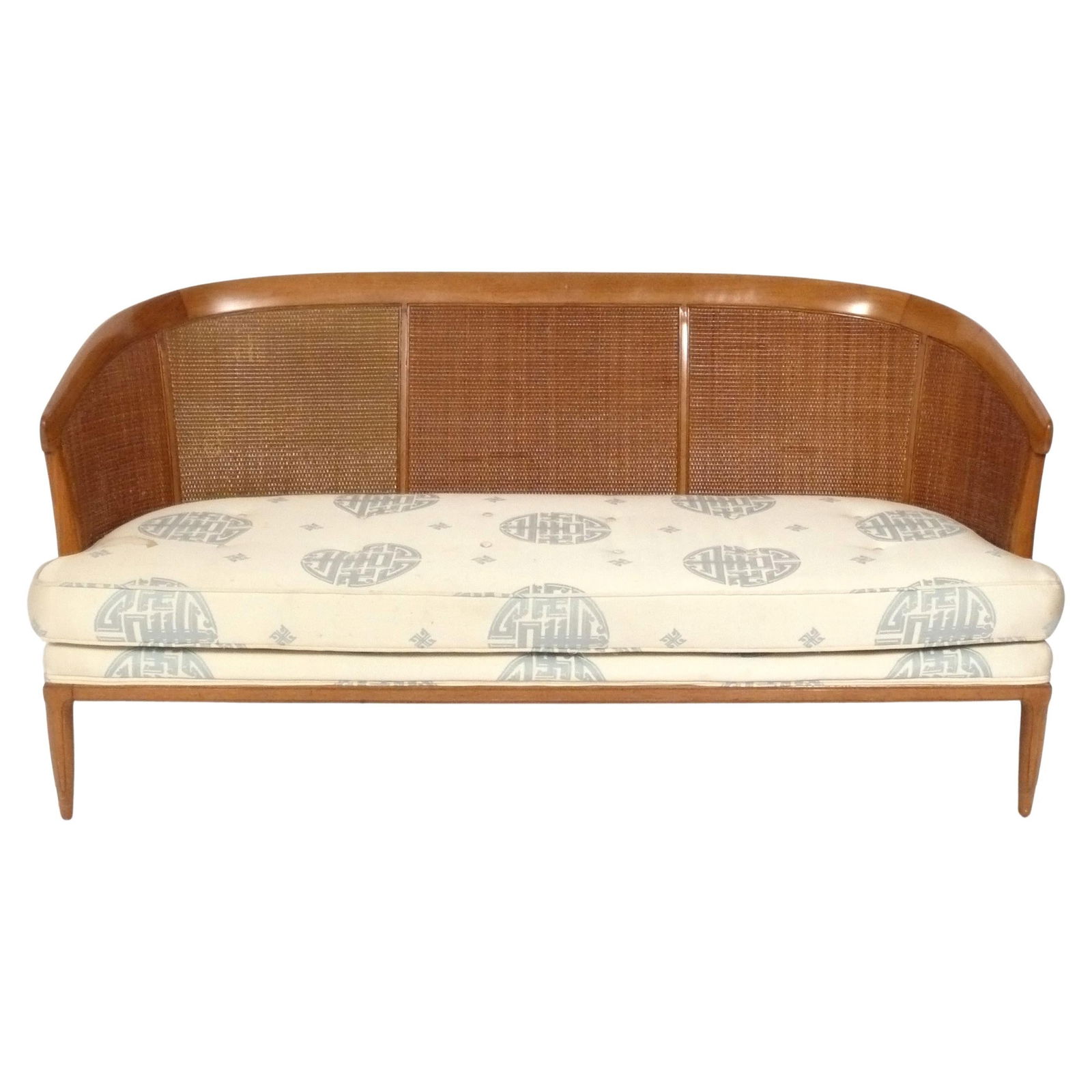 Curvaceous Caned Settee by Lubberts and Mulder for Tomlinson: Curvaceous caned settee designed by John Lubberts and Lambert Mulder for Tomlinson, American, circa 1950s. 28.5"H x 60"W x 21"D x 15.25" seat height. Furniture items are too large to ship via a common