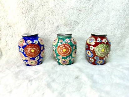 Set of 3 Hand-Painted Floral Porcelain Jars ā Japanese Style Decorative Vases: This charming set of three miniature porcelain jars features hand-painted floral motifs in vibrant cobalt blue, turquoise, and russet red tones. Embodying a rich Eastern aesthetic, each jar is signed