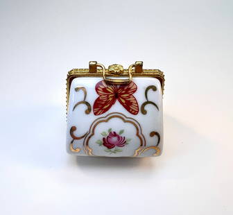 Miniature Porcelain Trinket Box with Floral and Butterfly Design: Square porcelain trinket box with hinged lid and gold-tone metal frame. Features hand-painted floral motifs and a red butterfly accent. Interior includes a small rose detail.Very good condition with n