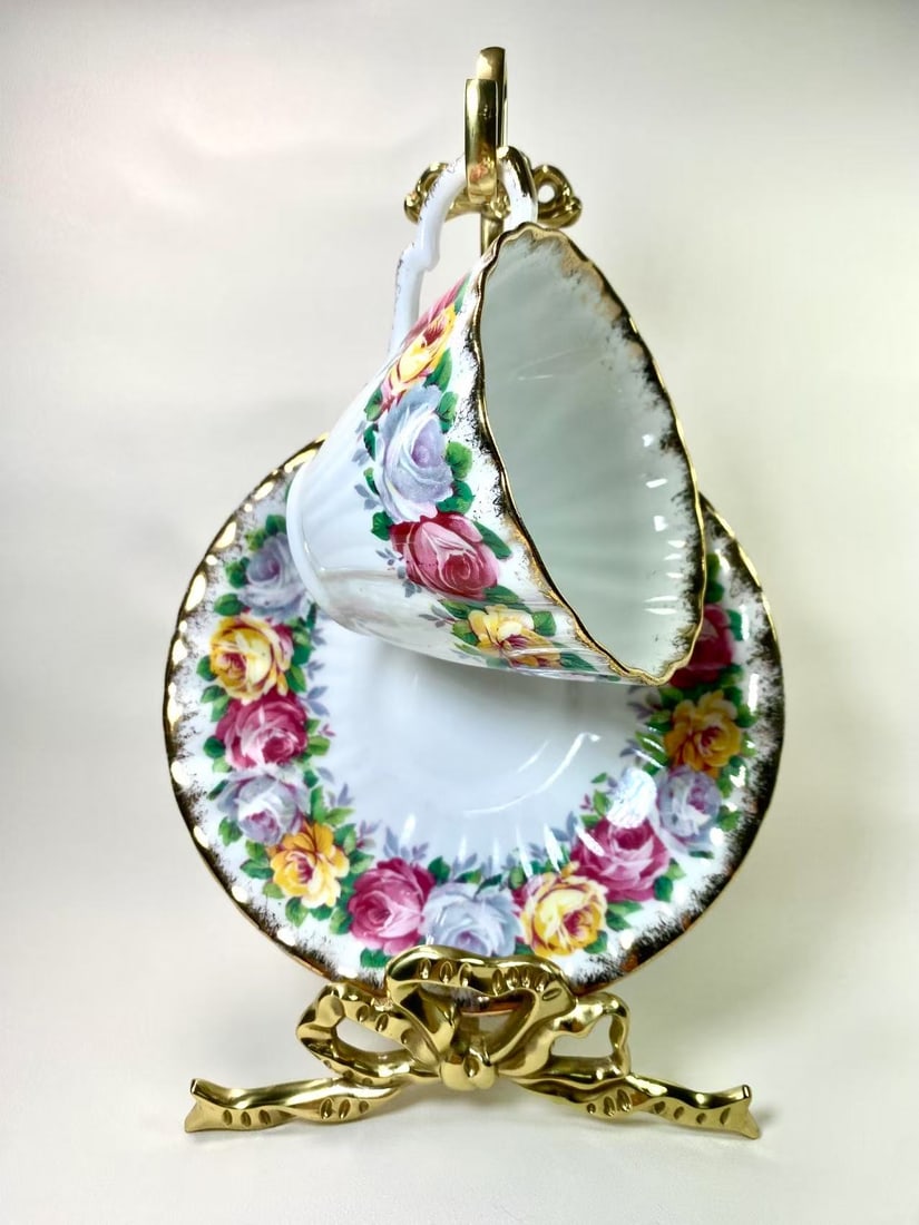 Gladstone Fine Bone China "Rosemary" Floral & Gold Trim Tea Cup and Saucer Set - England: This charming fine bone china tea cup and saucer set by Royal Vale features a delicate pink rose motif with subtle gold trim, exuding a classic English elegance. The gold-lined rims and scalloped edge