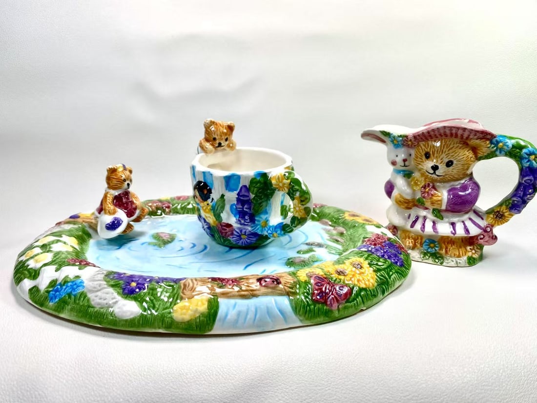 Whimsical Teddy Bear Ceramic Trio Set — Cup, Plate & Creamer: This charming ceramic set includes a teddy bear-themed creamer, a decorative plate, and a garden-themed tea cup. Each piece is adorned with vibrant hand-painted details and playful teddy bear characte