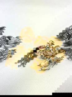 Lot of Vintage Gold Tone Clip-On Earrings: A lot of assorted vintage gold-tone clip-on earrings, featuring woven ball designs, dimensional leaves, rhinestone floral accents, and playful tassel details. All pairs included, perfect for collectio