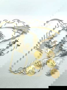 Vintage Gold Tone Assorted Jewelry Lot: Mixed lot of vintage gold tone jewelry including necklaces, bracelets, coin charms with profile motifs, engraved tags, and a feather brooch. Perfect for wear, creative projects, or jewelry collection.