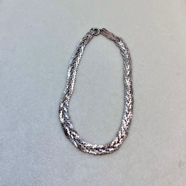 Vintage Mexican Sterling Silver Woven Bracelet –Marked 925 MEX MD28V: A beautifully woven multi-strand bracelet made of genuine 925 sterling silver, stamped “925 MEX” and marked with Mexican silversmith registration “MD28V.” The reflective snake-scale te