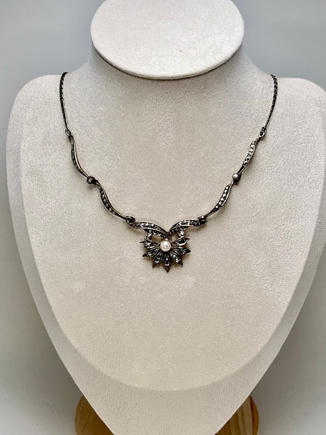 Antique German Marcasite & Pearl Pendant Necklace, Sterling Chain: A finely crafted antique pendant, attributed to 1930s Germany, designed in the Art Deco style with rose-cut marcasites and a luminous pearl centerpiece. The pendant bears a maker’s mark on the rever