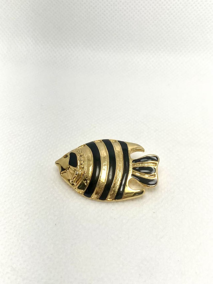 Vintage Gold and Black Striped Fish Brooch with Mark: This vintage brooch features a charming fish design with alternating gold and black stripes. It has a delicate texture and a secure pin clasp at the back. The lively form and nautical theme make it id