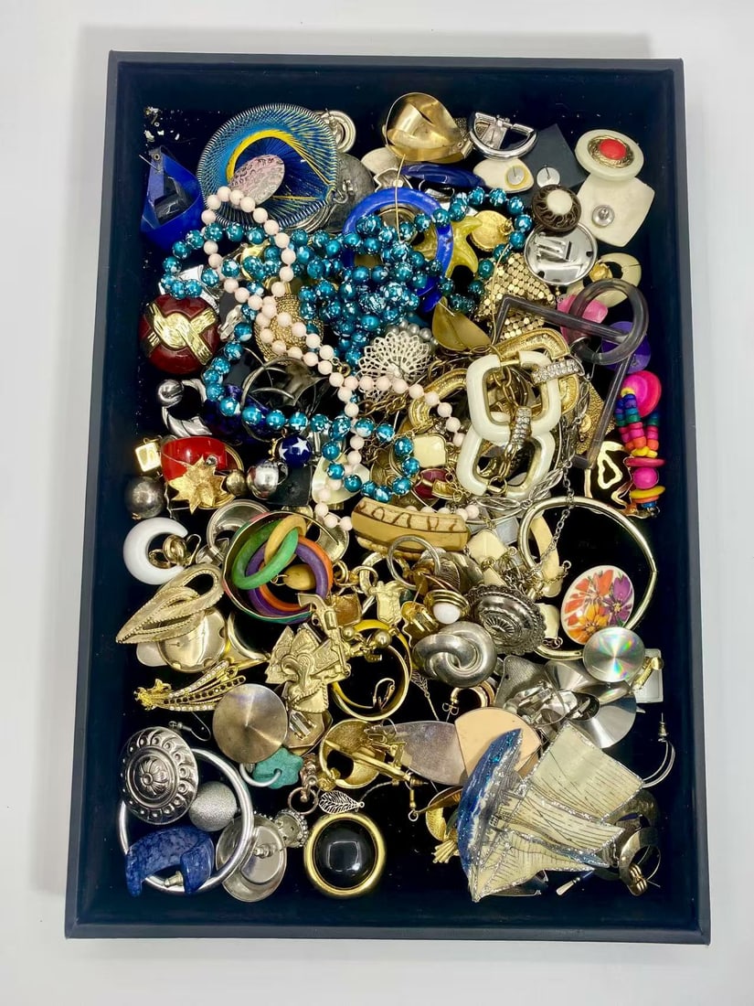 1 LB Unserached Jewelry Lot (As-Is, Tray Not Included): Assorted costume jewelry lot including necklaces, bracelets, earrings, pendants, and beaded pieces in various materials and styles. Contents are unsearched, unexamined, and untested, and are sold as-i