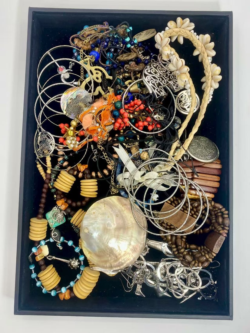 1 LB Unserached Jewelry Lot (As-Is, Tray Not Included): Assorted costume jewelry lot including necklaces, bracelets, earrings, pendants, and beaded pieces in various materials and styles. Contents are unsearched, unexamined, and untested, and are sold as-i