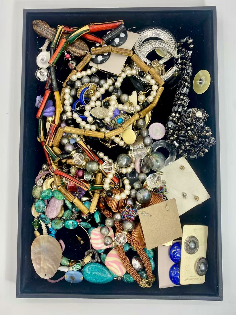 1 LB Unserached Jewelry Lot (As-Is, Tray Not Included): Assorted costume jewelry lot including necklaces, bracelets, earrings, pendants, and beaded pieces in various materials and styles. Contents are unsearched, unexamined, and untested, and are sold as-i