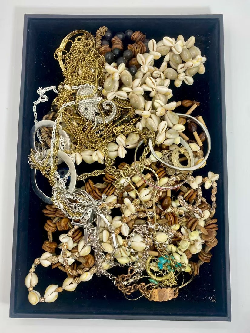 1 LB Unserached Jewelry Lot (As-Is, Tray Not Included): Assorted costume jewelry lot including necklaces, bracelets, earrings, pendants, and beaded pieces in various materials and styles. Contents are unsearched, unexamined, and untested, and are sold as-i
