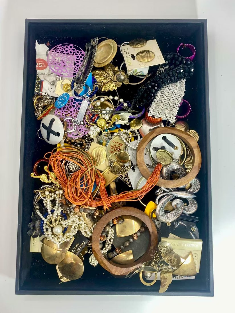 1 LB Unserached Jewelry Lot (As-Is, Tray Not Included): Assorted jewelry lot including necklaces, bracelets, earrings, pendants, and beaded pieces in various materials and styles. Contents are unsearched, unexamined, and untested, and are sold as-is. Items