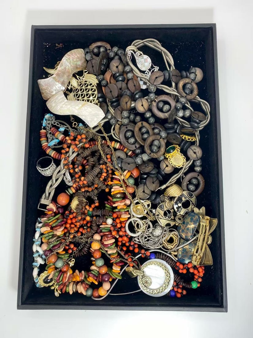 1 LB Unserached Jewelry Lot (As-Is, Tray Not Included): Assorted jewelry lot including necklaces, bracelets, earrings, pendants, and beaded pieces in various materials and styles. Contents are unsearched, unexamined, and untested, and are sold as-is. Items
