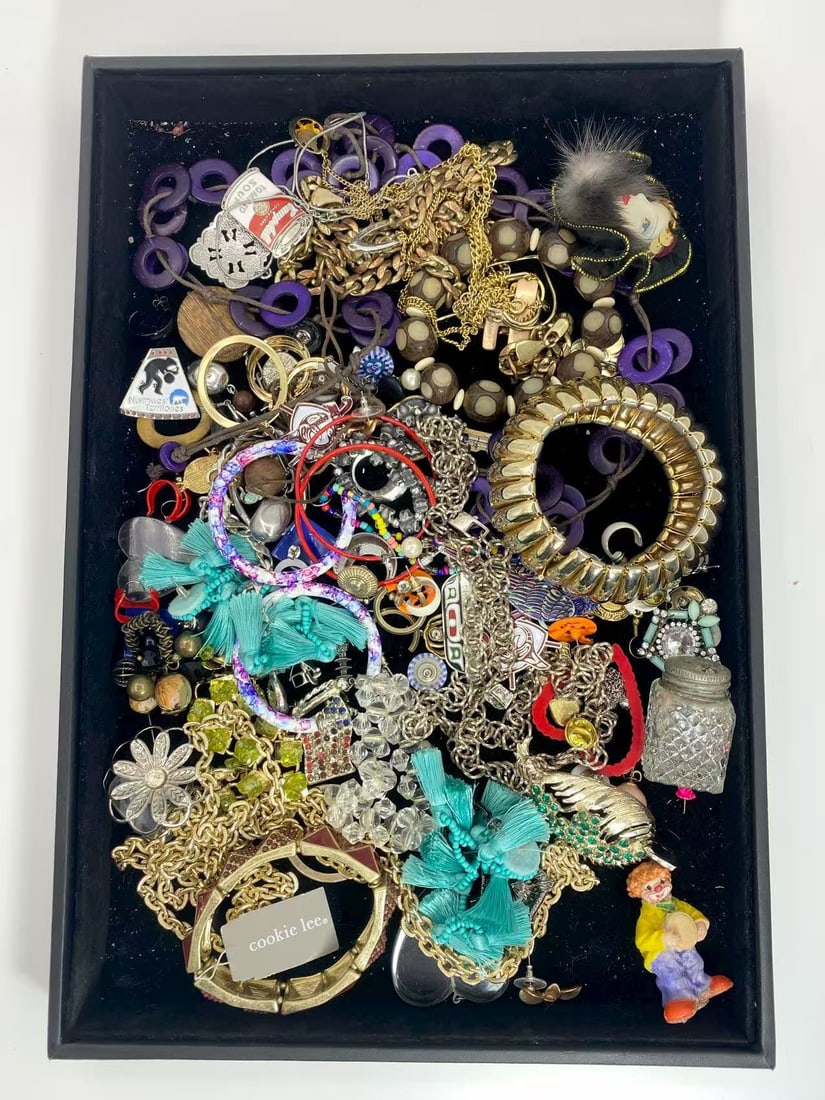 1 LB Unserached Jewelry Lot (As-Is, Tray Not Included): Assorted jewelry lot including necklaces, bracelets, earrings, pendants, and beaded pieces in various materials and styles. Contents are unsearched, unexamined, and untested, and are sold as-is. Items