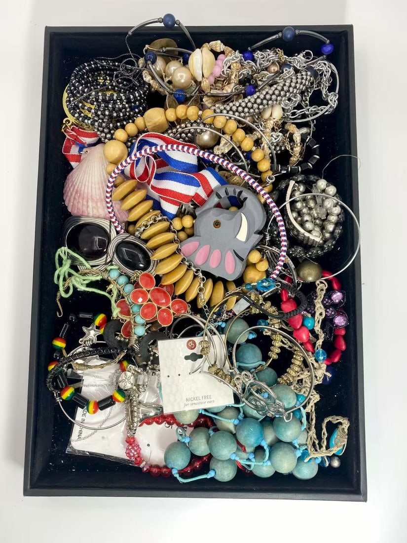 2 LB Unserached Jewelry Lot (As-Is, Tray Not Included): Assorted jewelry lot including necklaces, bracelets, earrings, pendants, and beaded pieces in various materials and styles. Contents are unsearched, unexamined, and untested, and are sold as-is. Items