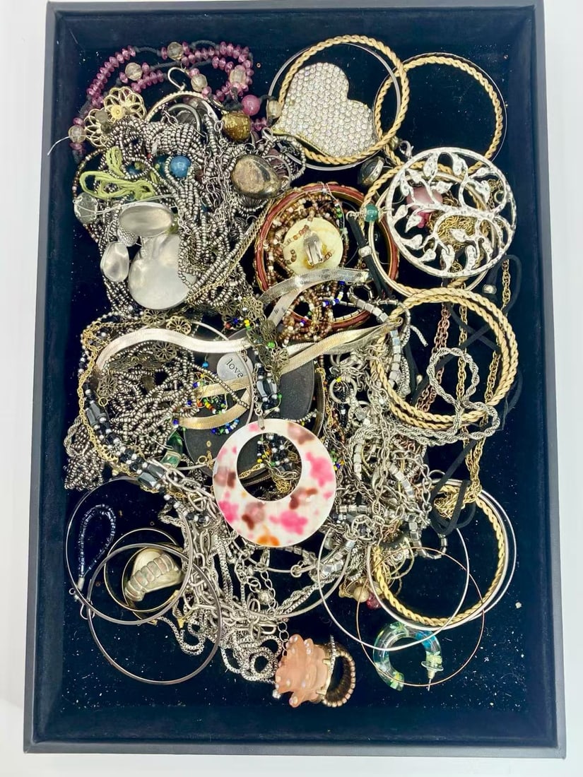 1 LB Unserached Jewelry Lot (As-Is, Tray Not Included): Assorted costume jewelry lot including necklaces, bracelets, earrings, pendants, and beaded pieces in various materials and styles. Contents are unsearched, unexamined, and untested, and are sold as-i