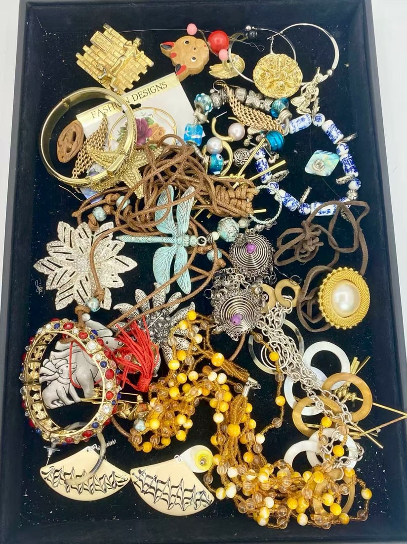 1 LB Unserached Jewelry Lot (As-Is, Tray Not Included): Assorted costume jewelry lot including necklaces, bracelets, earrings, pendants, and beaded pieces in various materials and styles. Contents are unsearched, unexamined, and untested, and are sold as-i