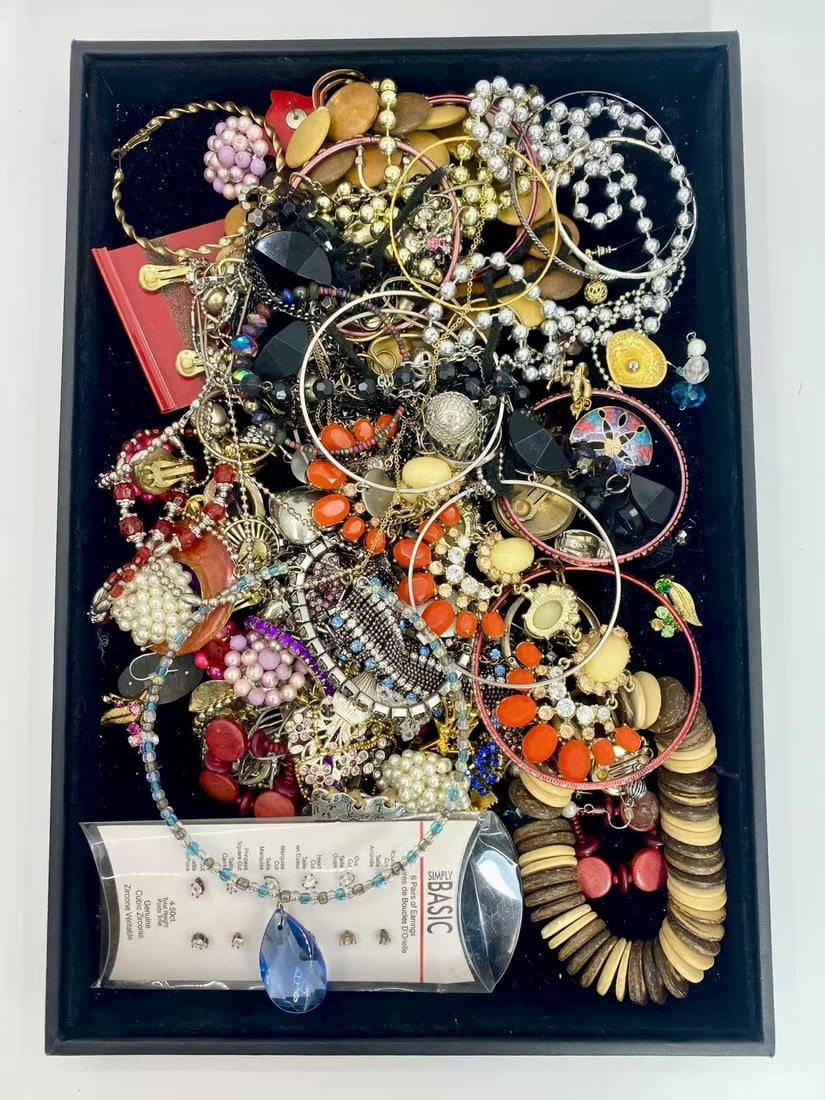 1 LB Unserached Jewelry Lot (As-Is, Tray Not Included): Assorted costume jewelry lot including necklaces, bracelets, earrings, pendants, and beaded pieces in various materials and styles. Contents are unsearched, unexamined, and untested, and are sold as-i