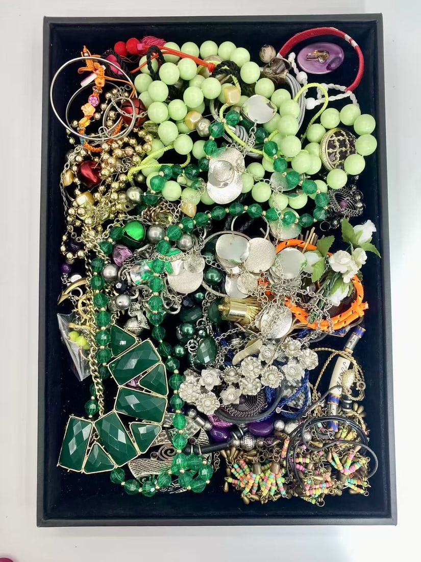 1 LB Unserached Jewelry Lot (As-Is, Tray Not Included): Assorted costume jewelry lot including necklaces, bracelets, earrings, pendants, and beaded pieces in various materials and styles. Contents are unsearched, unexamined, and untested, and are sold as-i