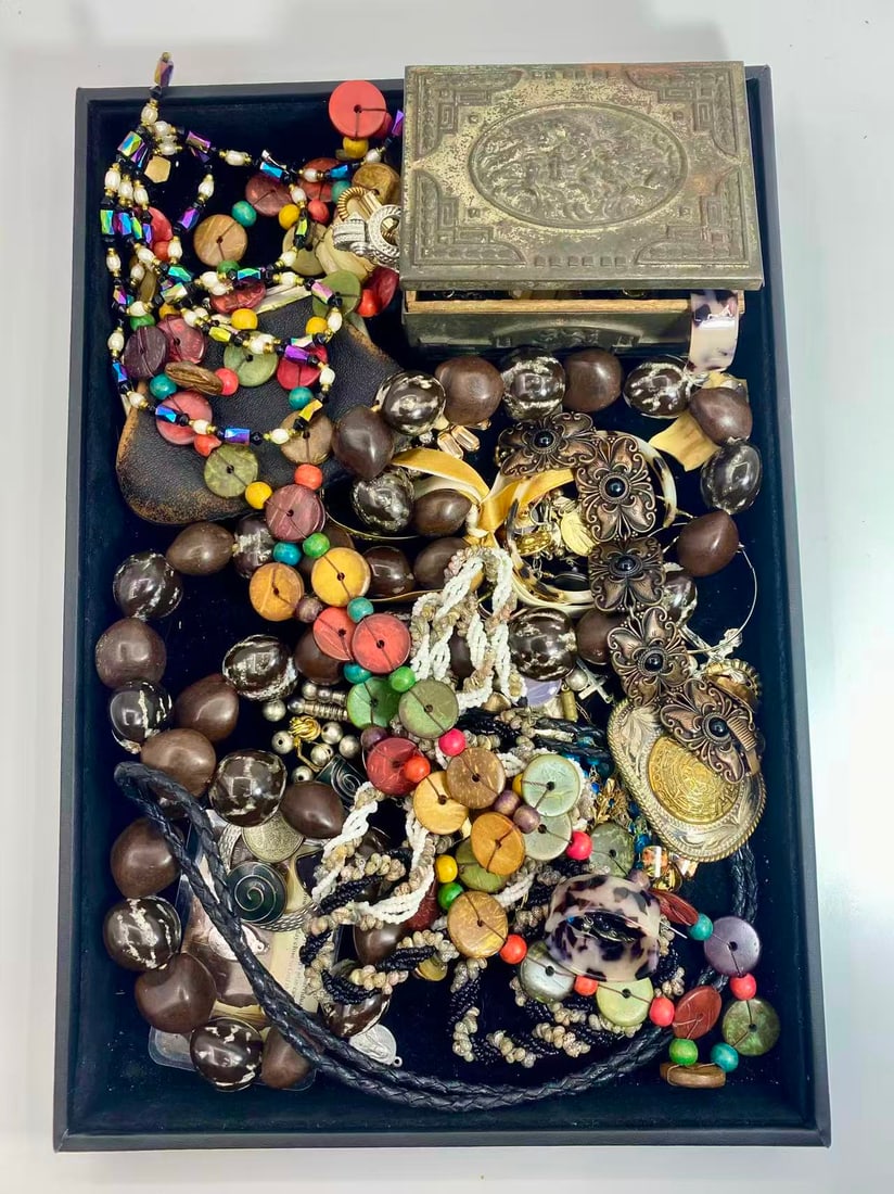 1 LB Unserached Jewelry Lot: A large unsearched jewelry lot containing a wide variety of items, including vintage costume jewelry, beads, bangles, necklaces, earrings, brooches, and other assorted pieces. The lot has not been sor