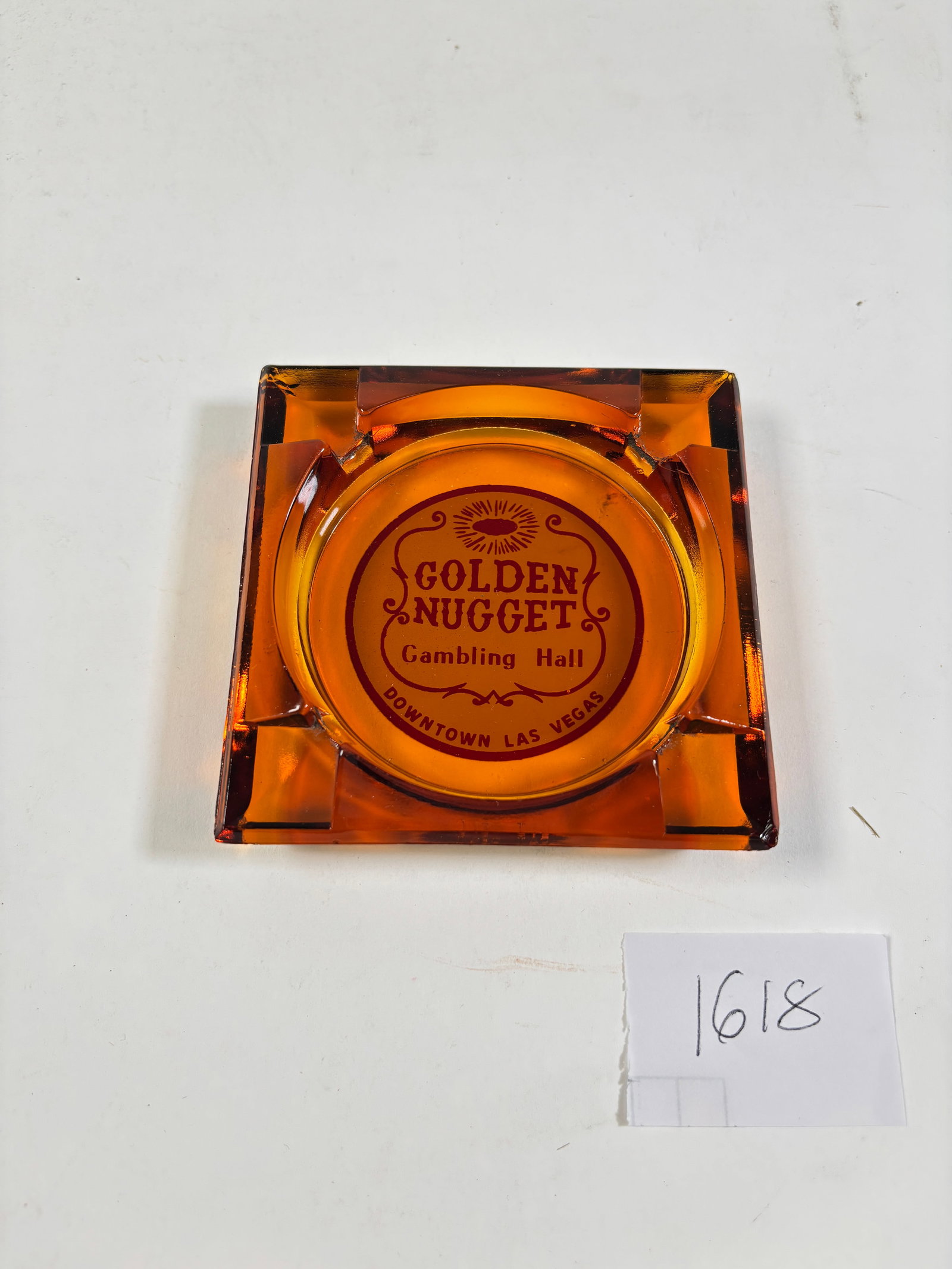 Golden Nugget Las Begas Gambling Hall Ashtray in Amber Glass: Golden Nugget Las Vegas Gambling Hall Amber Glass AshtrayVintage amber glass ashtray featuring the iconic Golden Nugget Las Vegas Gambling Hall logo. A great collectible for casino and vintage memorab