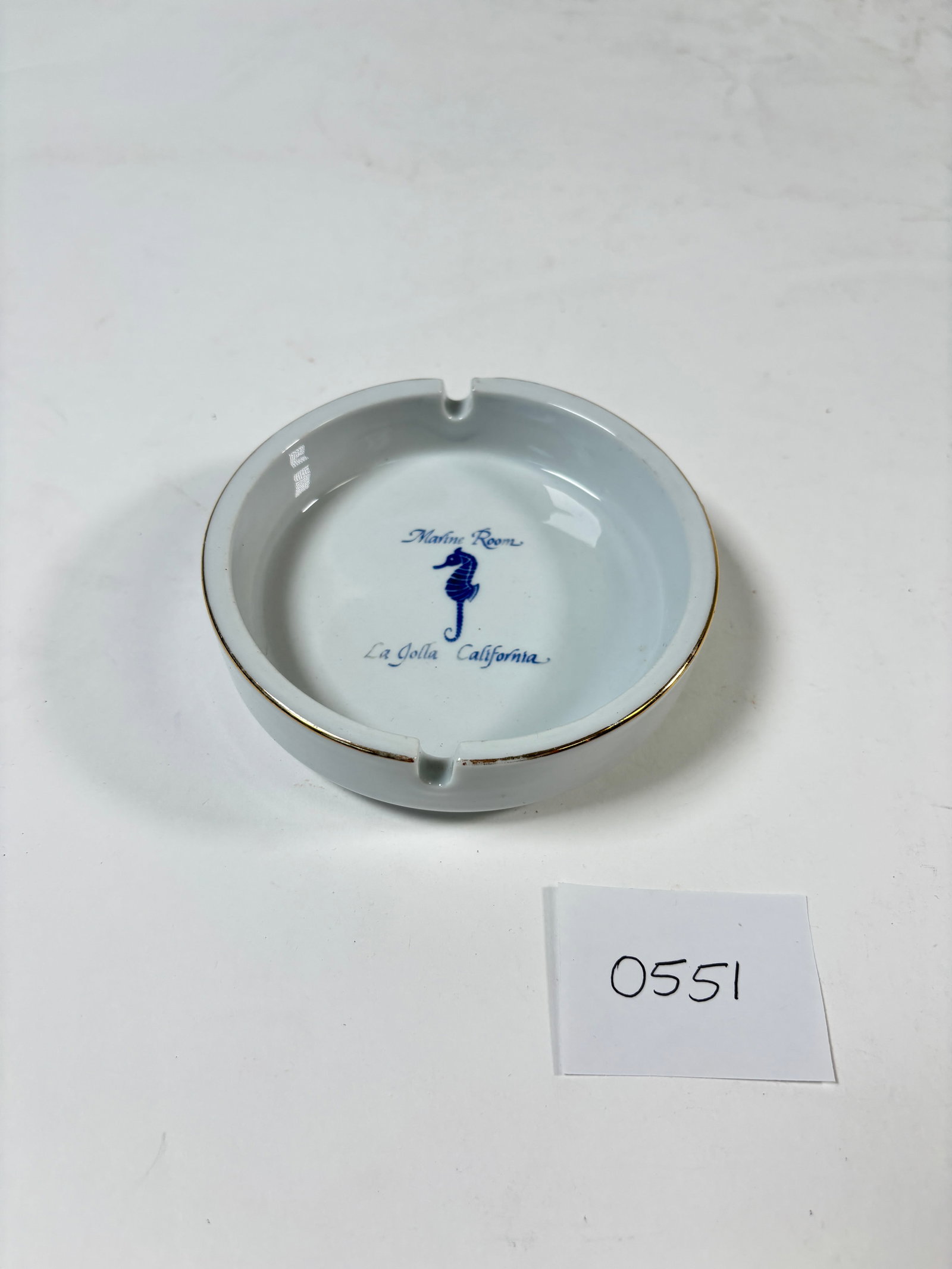 Vintage Porceline La Jolla California The Marine Room Ashtray: This vintage porcelain ashtray from La Jolla, California, features a charming seahorse design, along with a depiction of The Marine Room. A unique collectible piece, this ashtray captures the beauty o