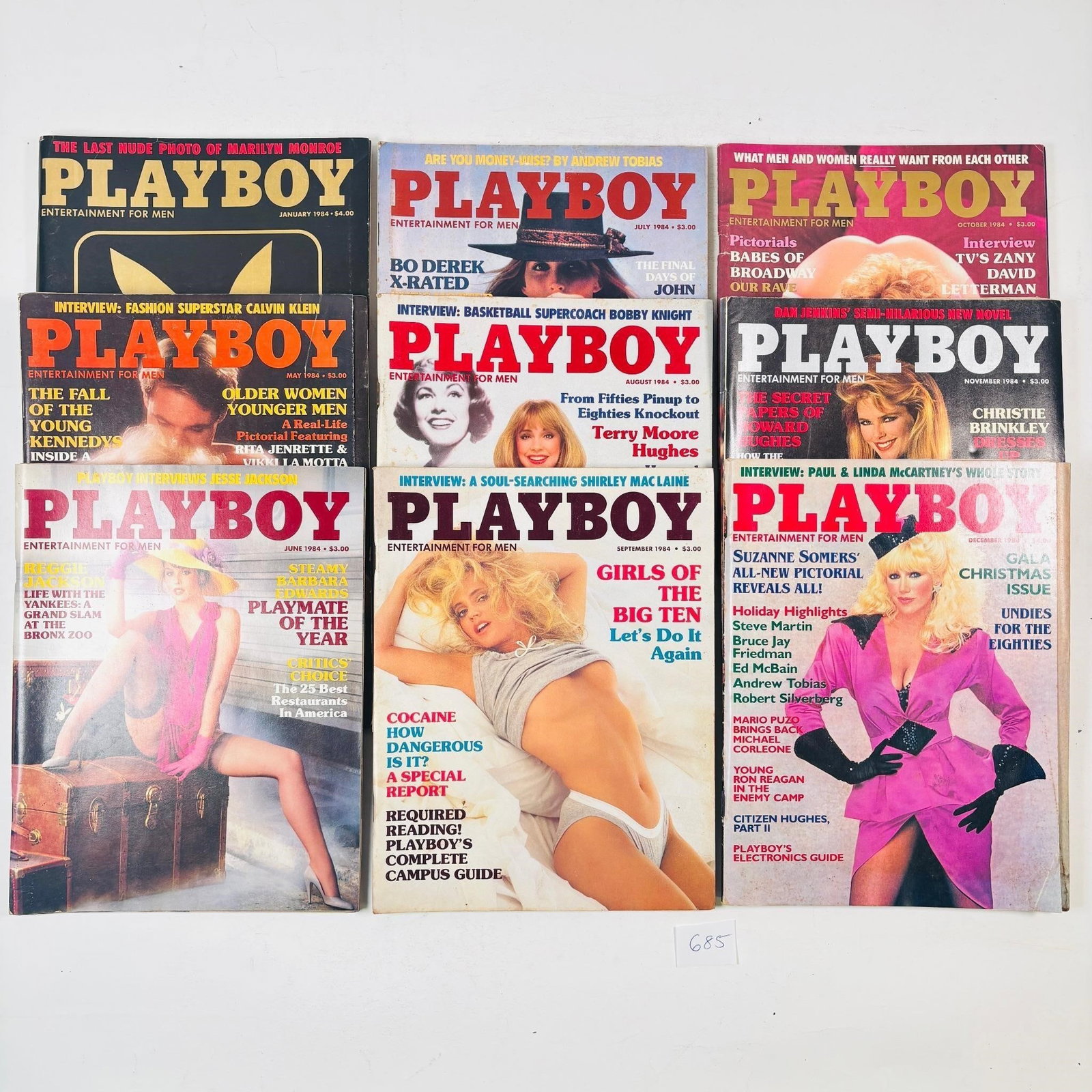 Vintage Playboy Magazines Set of 9 (1984): Assorted set of 9 Playboy magazines from the year 1984. Features iconic photography, interviews, articles, and advertisements from the era. Great for collectors or vintage media enthusiasts.Sold as-is