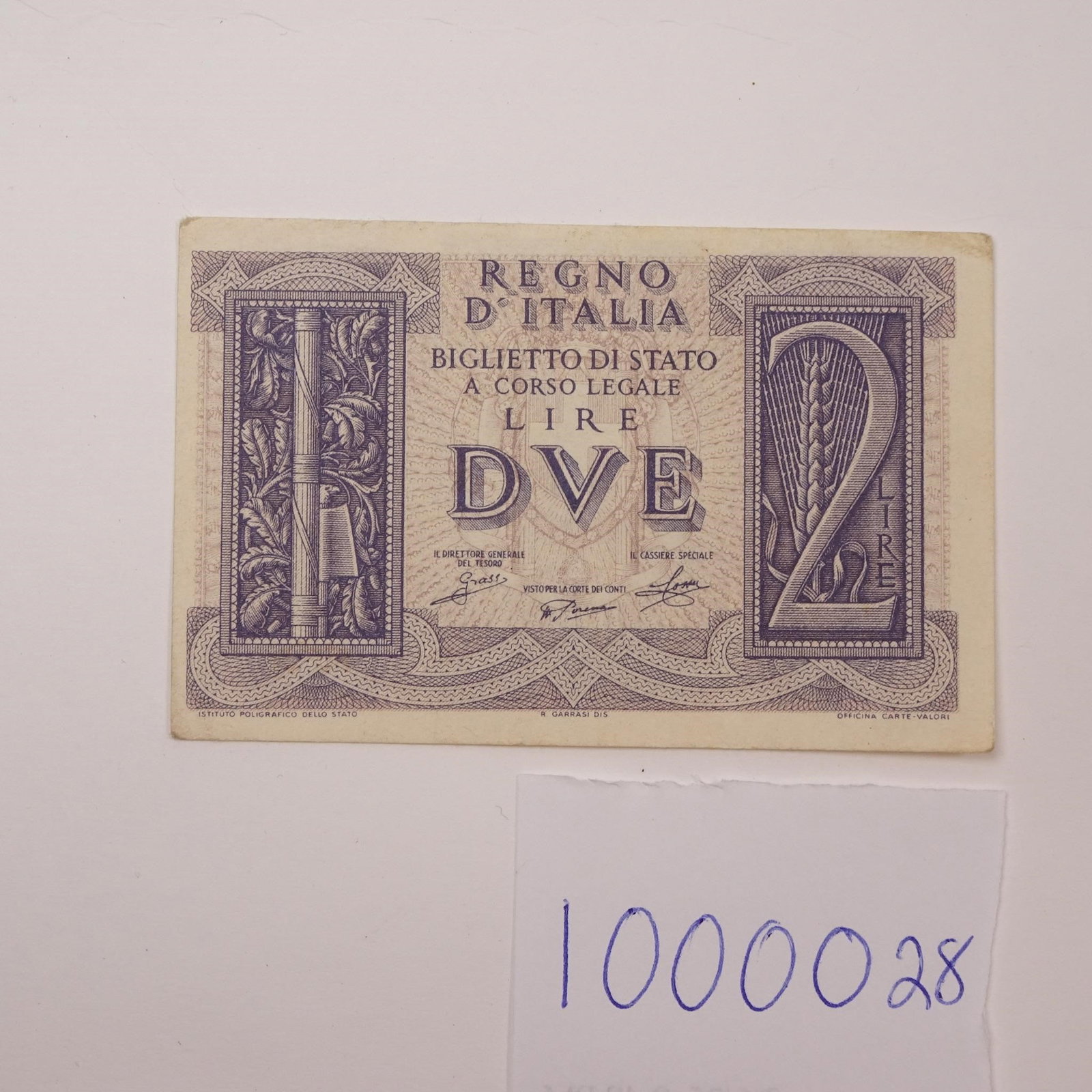 Italy - 2 Lire - 1939:: This WWII-era 2 Lire banknote from 1939 offers a glimpse into Italy's wartime currency issued just prior to and during the early years of the conflict. A historically significant piece for collectors 