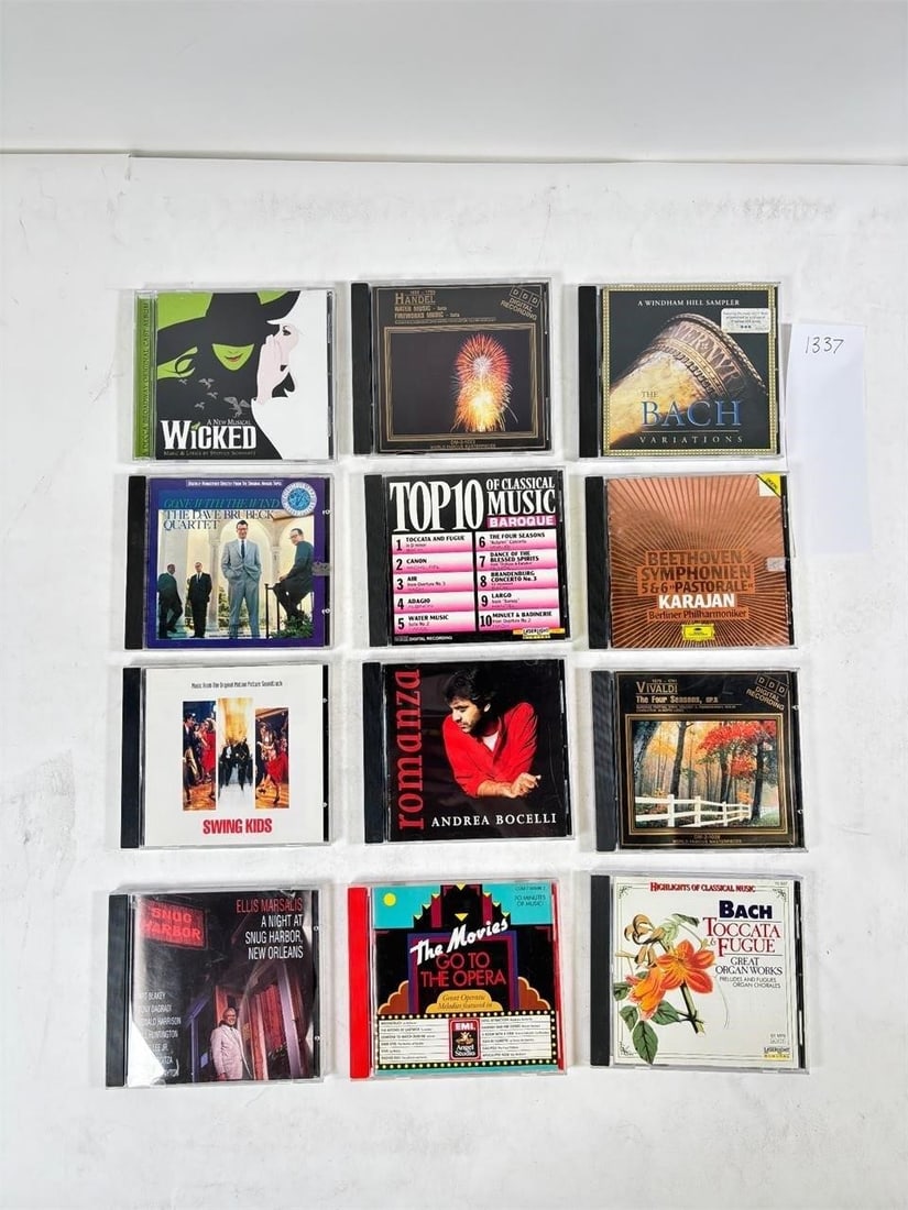 Assorted CD Set of 12 The Wicked Musical & More: Assorted CD Collection Set of 12 Mixed artists and genres. Condition varies; please refer to photos for details