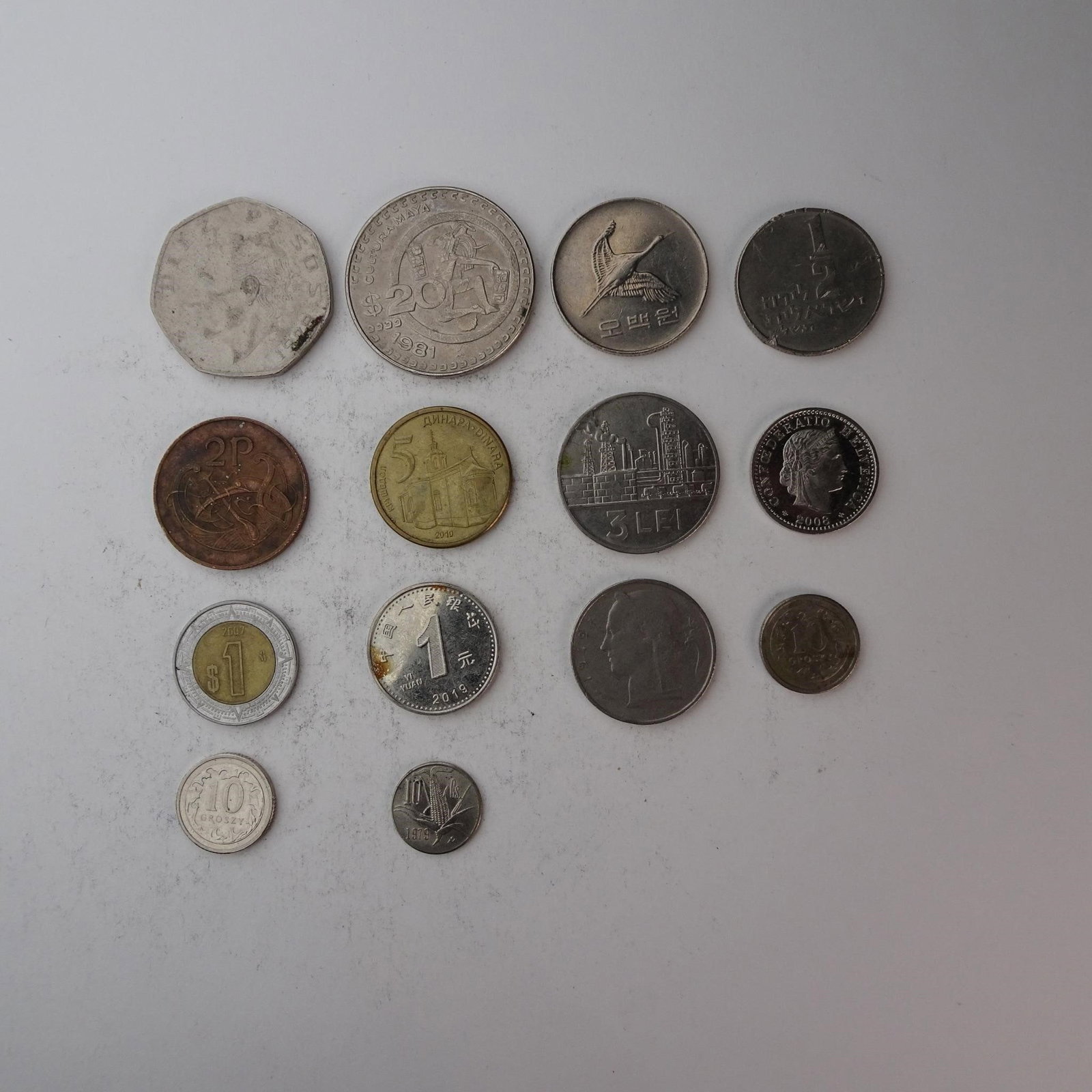 Diverse Assortemnt of International Coins Set...: of International Coins Set of 14 (Serbia, Romania, China, and more). Diverse collection perfect for starting a collection, filling gaps, or for educational purposes. Years and mint marks included in t