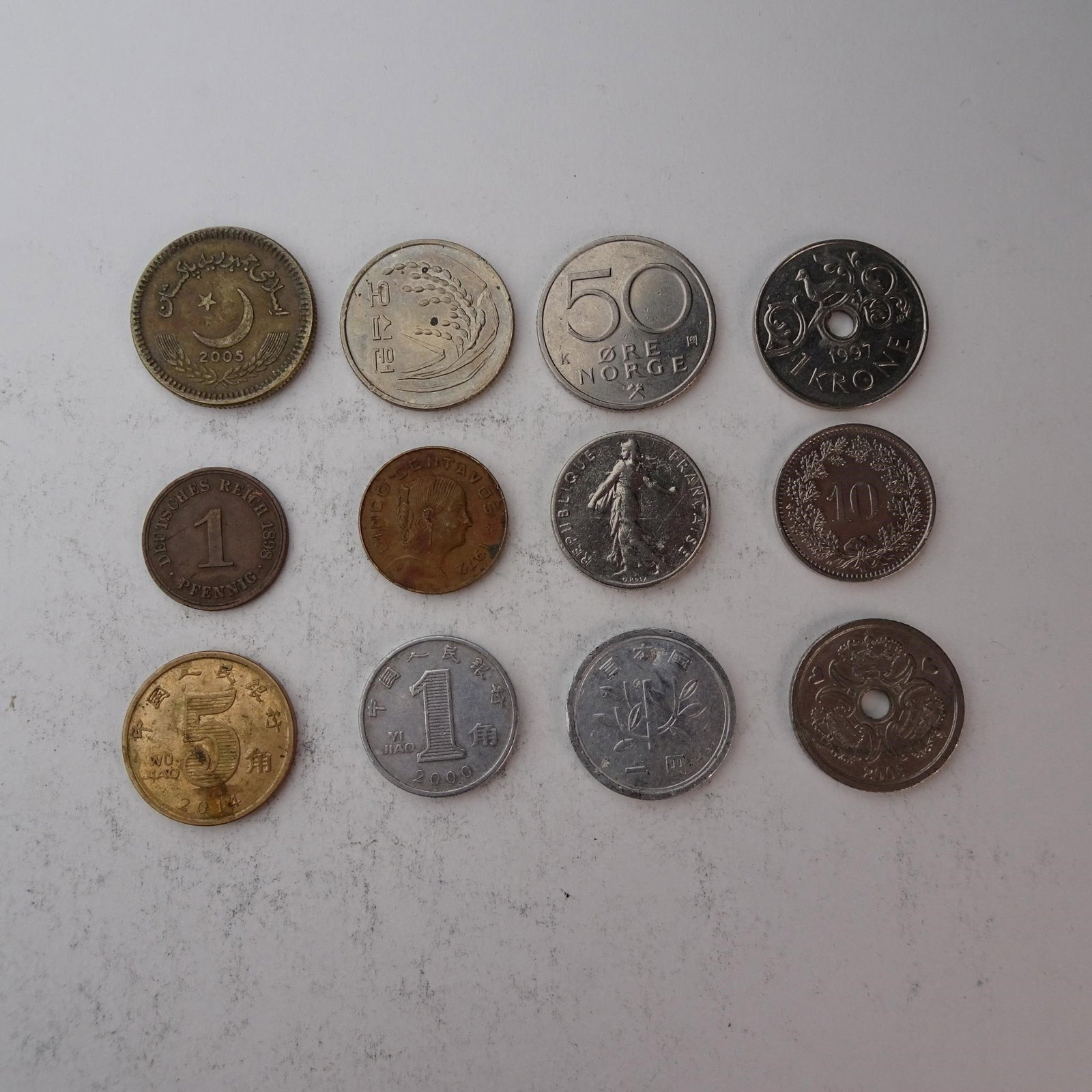 Diverse Assortemnt of International Coins Set...: of International Coins Set of 12 (China, Pakistan, France and more). Diverse collection perfect for starting a collection, filling gaps, or for educational purposes. Years and mint marks included in t