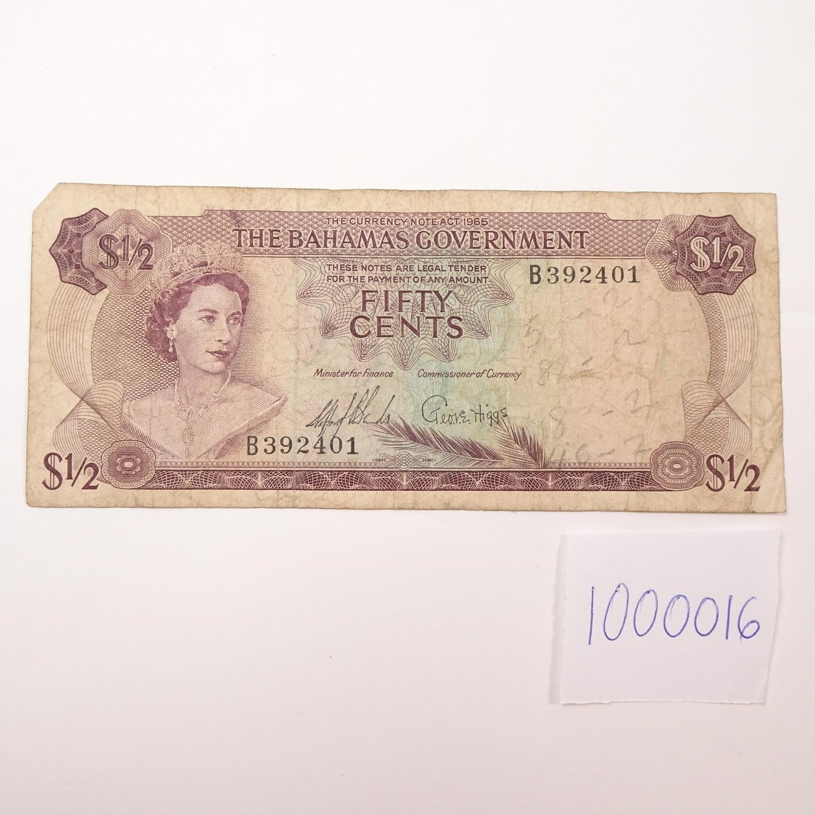 Bahamas 50 Cents Banknote - 1965 (Sands & Higgs):: A collectible half-dollar note issued by the Bahamas in 1965 featuring signatures from Sands and Higgs. A beautiful piece of Caribbean currency history. Condition varies; please refer to photos for sp