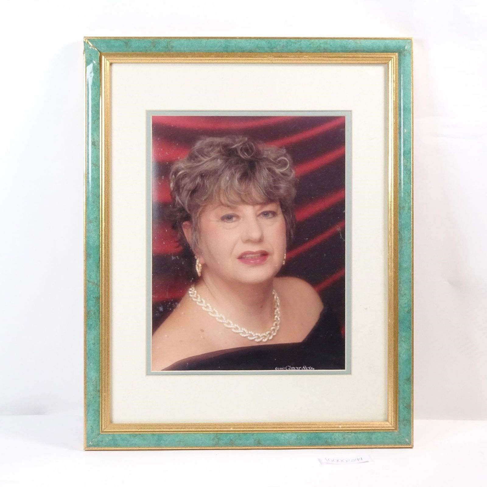 Vintage Framed Portrait: A framed portrait, a classic example of the "Glamour Shots" trend from 1997. This piece is a fun and nostalgic tribute to 90s pop culture, perfect for adding a touch of retro charm and humor to any ho