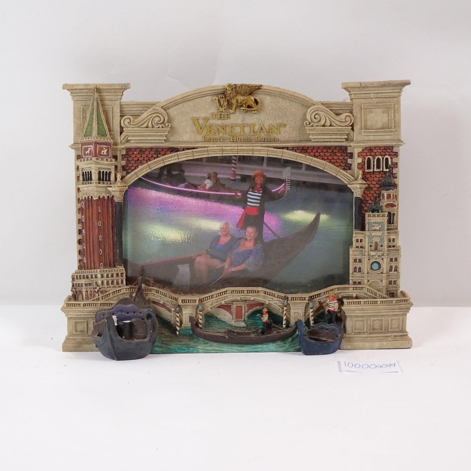 Venetian 3D Las Vegas Resort Photo Frame: A unique and decorative photo frame featuring a 3D image of the iconic Venetian Las Vegas Resort. This souvenir piece captures the grandeur of the hotel's famous canals and architecture, perfect for s