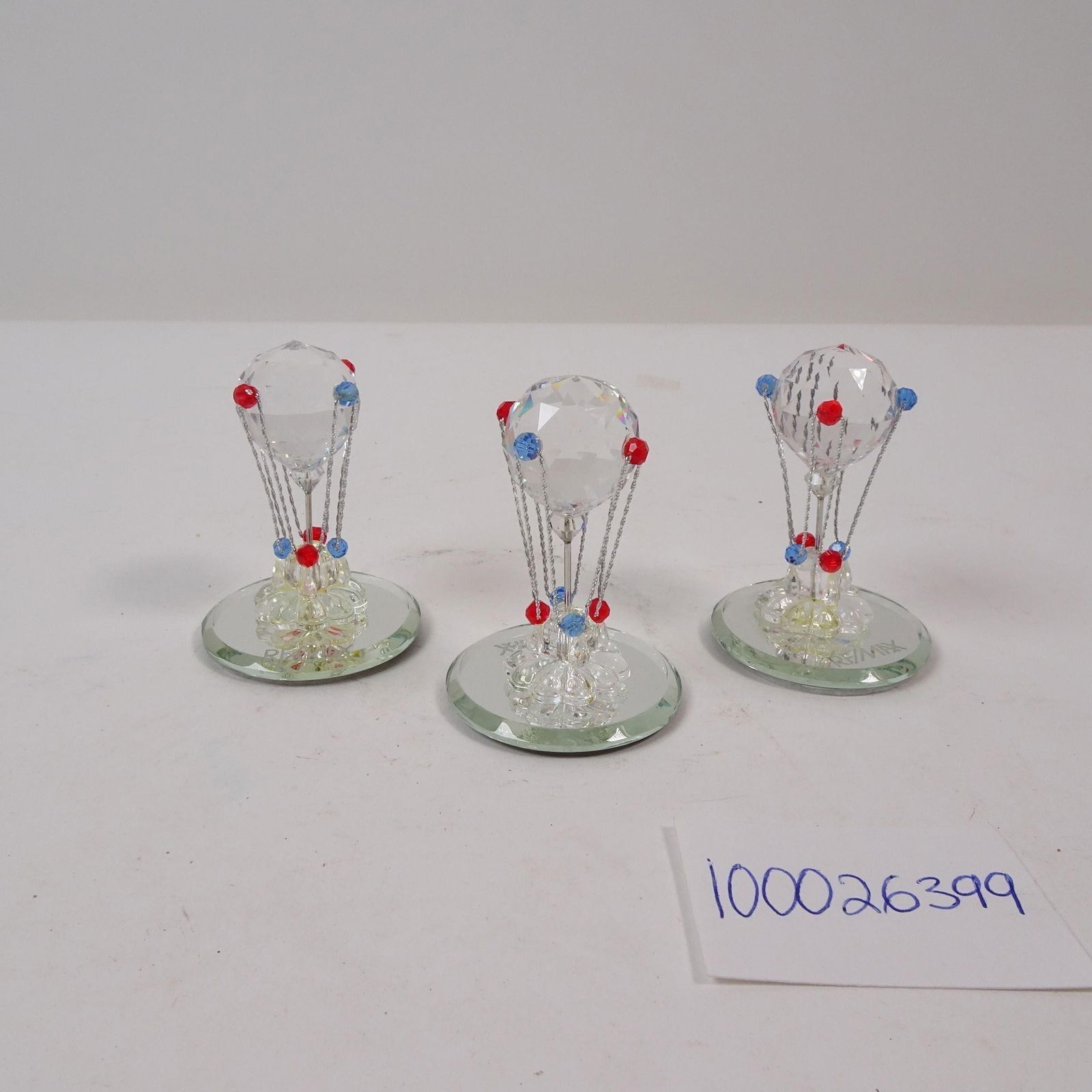 Small Crystal Hot Air Balloon Figurines Set of 3: A beautiful decorative set of three small crystal hot air balloon figurines. This collection is perfect for adding a touch of classic elegance and whimsical charm, with the crystal catching the light