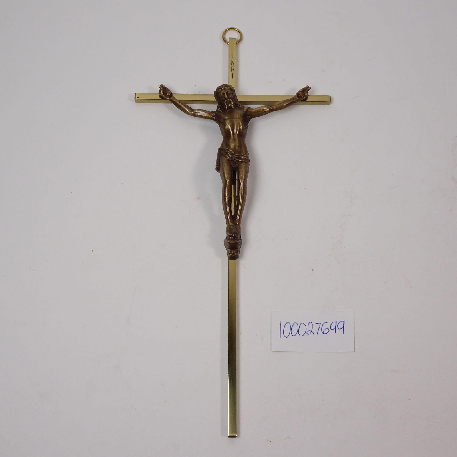 Metal Brass Crucifix: A decorative crucifix, crafted from metal with a brass finish. This piece is a classic religious and spiritual symbol, perfect for adding a touch of traditional reverence and timeless character to any