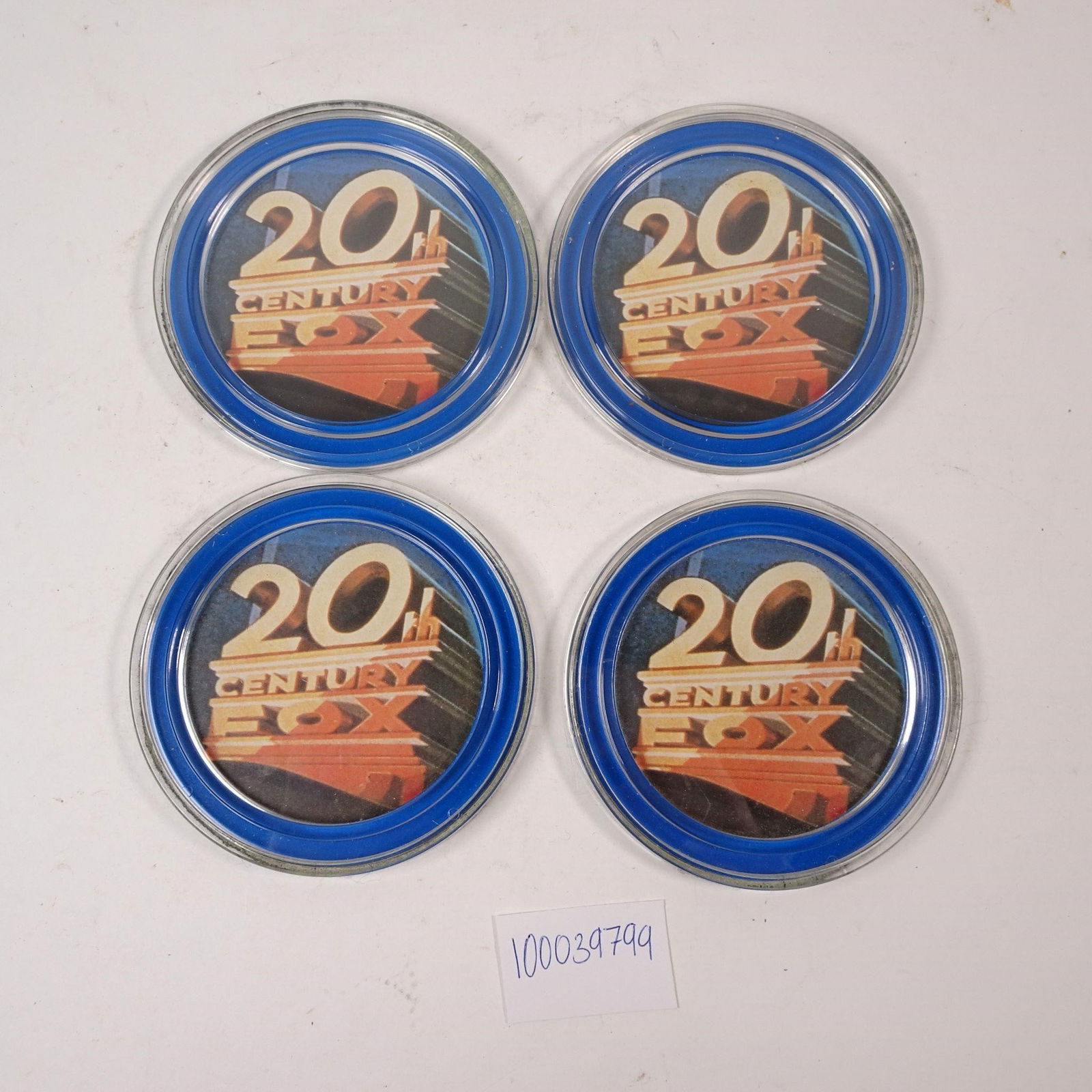 20th Century Fox Coasters Set of 4: A set of four collectible 20th Century Fox coasters, perfect for protecting your furniture with cinematic style. These pieces are ideal for movie lovers and enthusiasts of film history, adding a nosta
