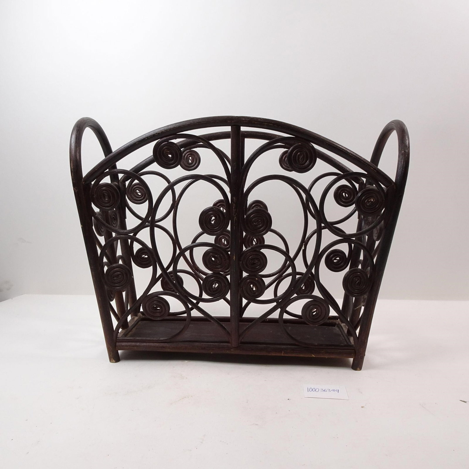 Vinatage Wooden Magazine Rack: A functional vintage wooden magazine rack, perfect for stylishly storing magazines, newspapers, or books. This classic piece adds a touch of mid-century charm and nostalgic warmth to any living room, 