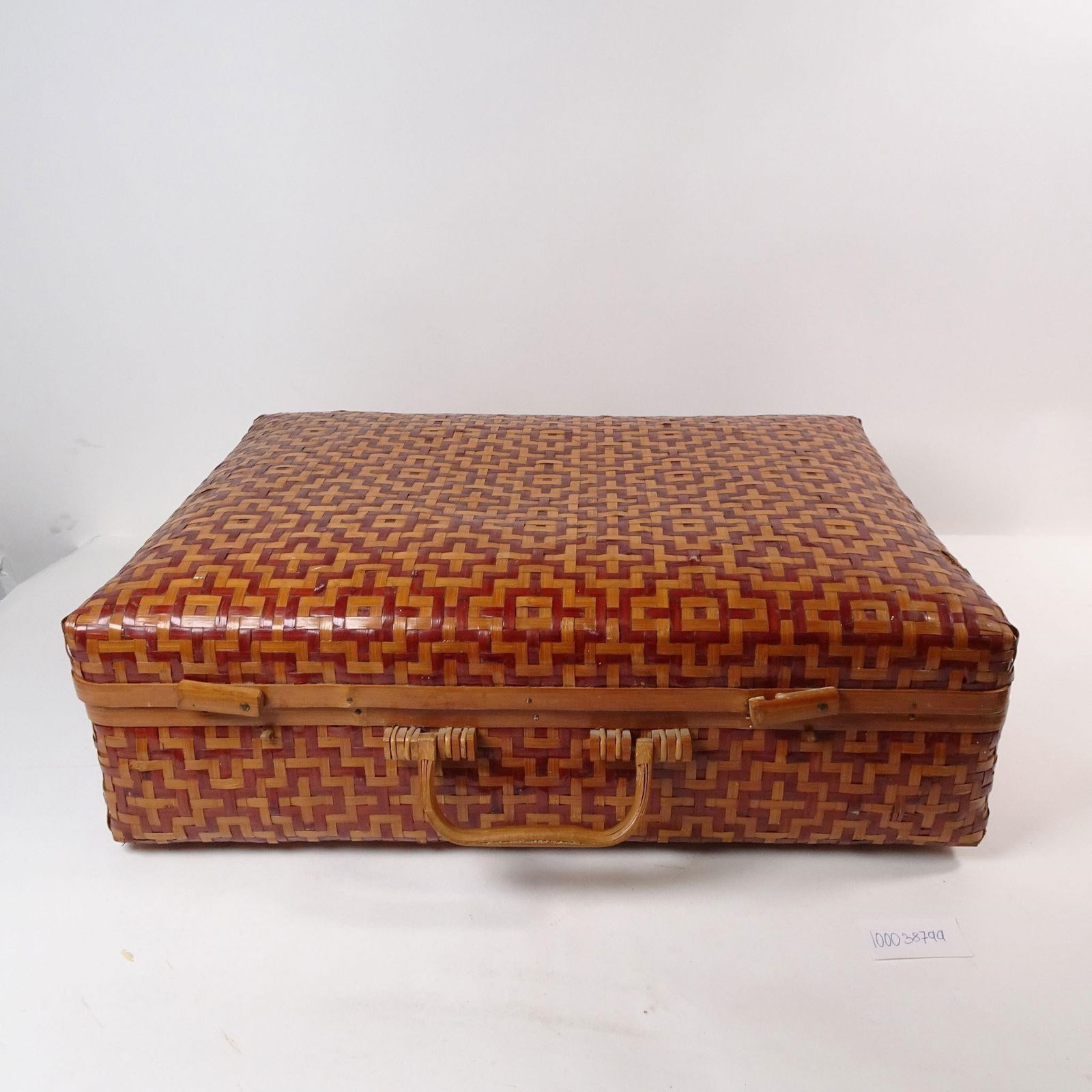 Vintage Chinese Wicker Suitcase: A classic vintage Chinese wicker suitcase, perfect for unique storage or as a distinctive decorative accent. This charming piece adds a touch of rustic, global character and nostalgic elegance to any