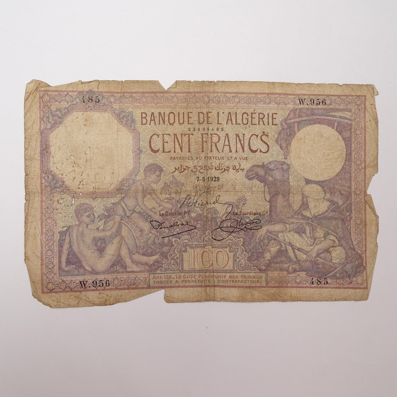 Tunesia - 100 Francs Banknote - 1929:: This 1929 100 Francs banknote from Tunisia is a fascinating historical artifact from French colonial rule. Issued by the Banque de l'Algrie, it features an Arab man with a camel, symbolizing local cul
