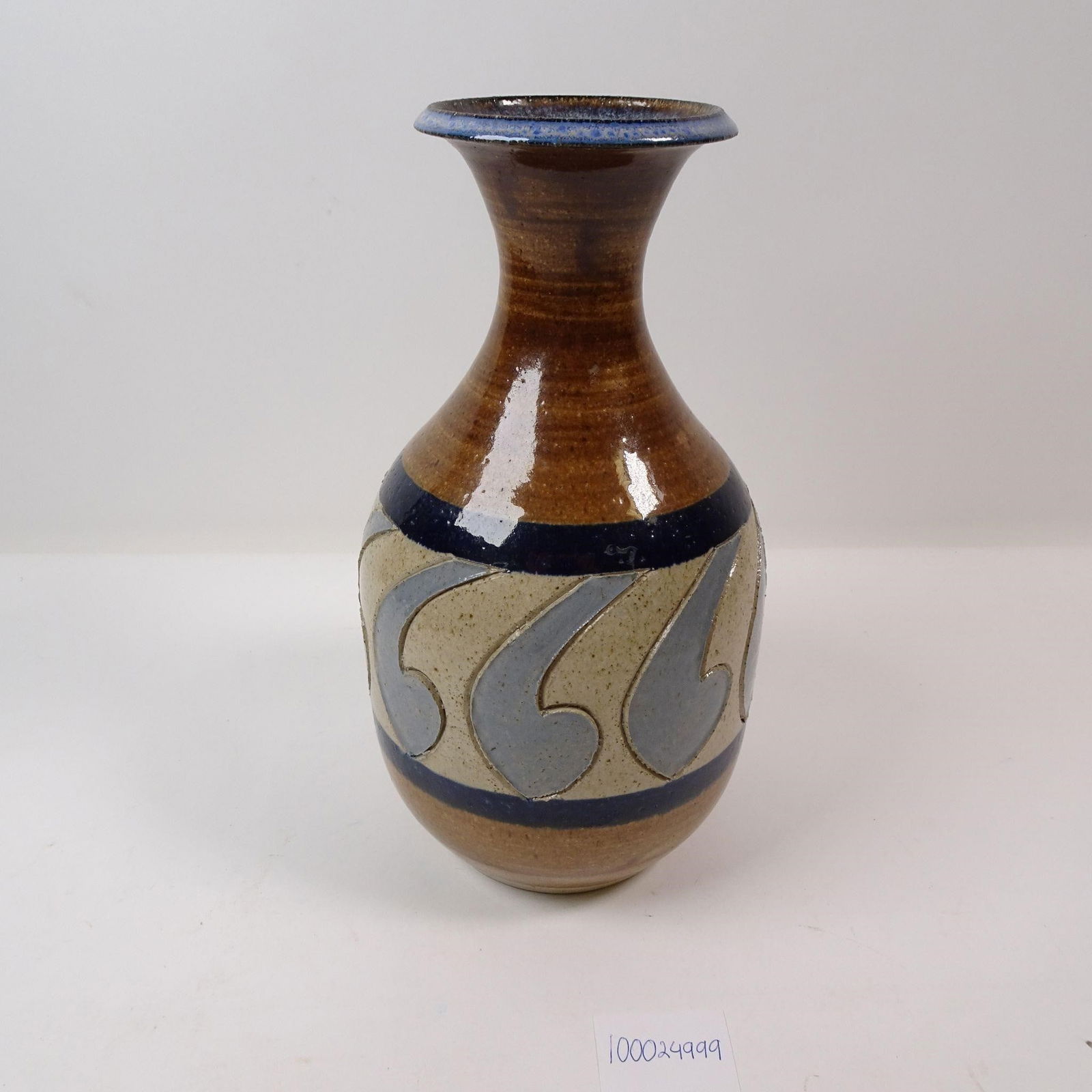 Vintage Glazed Pottery Vase Hand Painted: A decorative and classic vintage glazed pottery vase, perfect for displaying a bouquet of flowers or as a standalone accent piece. This piece adds a touch of rustic charm and timeless character to any