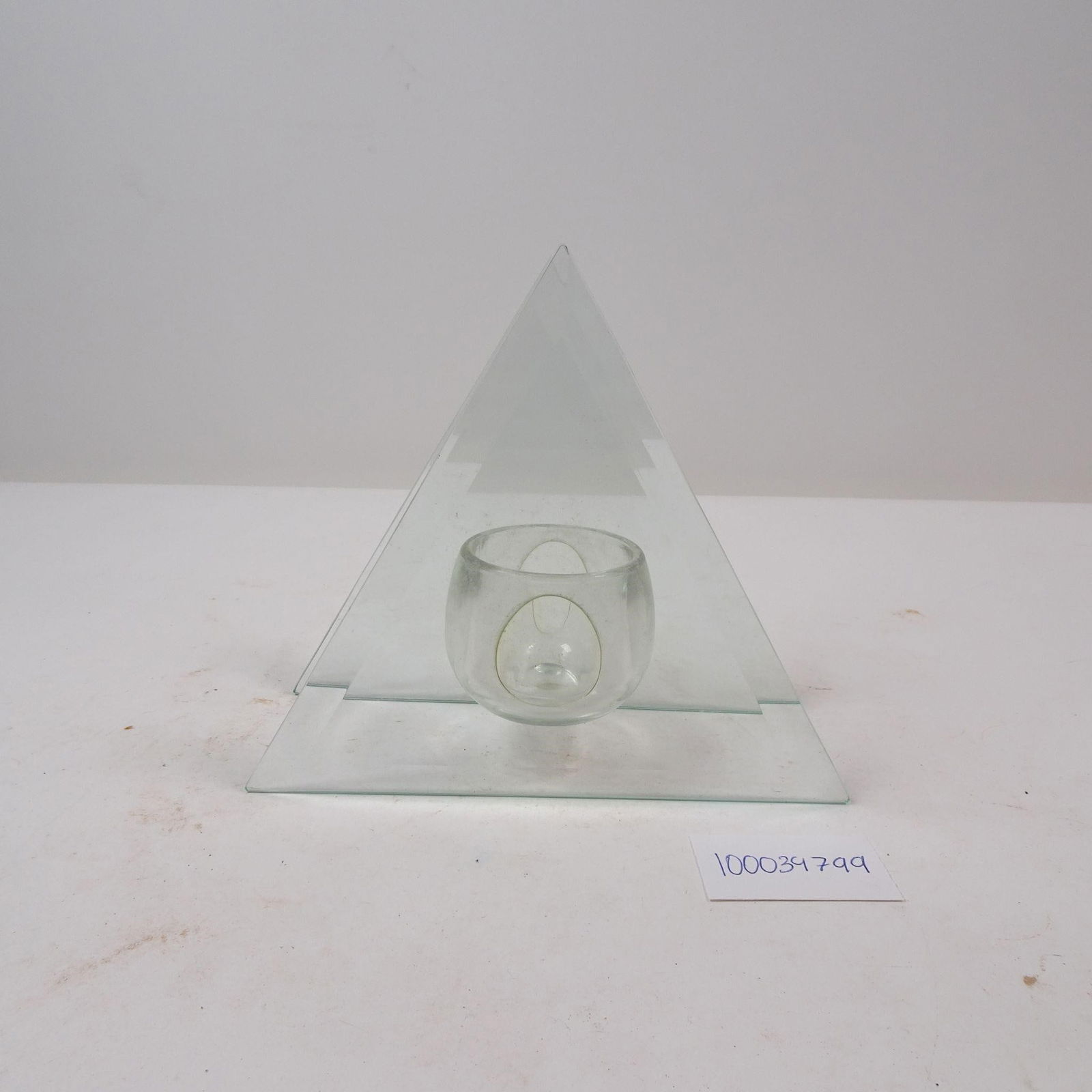 Vtg Accent Glass Triangle Candle Holder: A charming vintage glass triangle candle holder, perfect for adding a touch of classic simplicity and geometric style. This piece is ideal for creating a warm, ambient glow, making it a wonderful acce