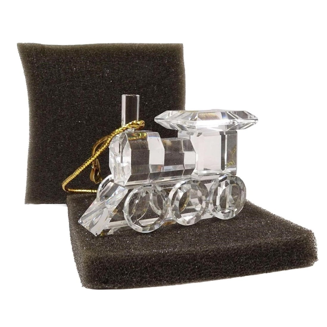 Timeless Treasure Cut Crystal Ornament Train: Timeless Treasure cut crystal ornament featuring a train design. Elegant collectible piece with sparkling detail, ideal for display or gifting. Condition varies; please refer to photos for details.Sol