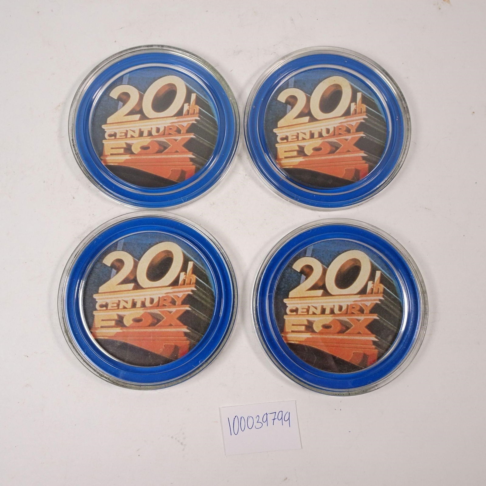20th Century Fox Coasters Set of 4: A set of four collectible 20th Century Fox coasters, perfect for protecting your furniture with cinematic style. These pieces are ideal for movie lovers and enthusiasts of film history, adding a nosta