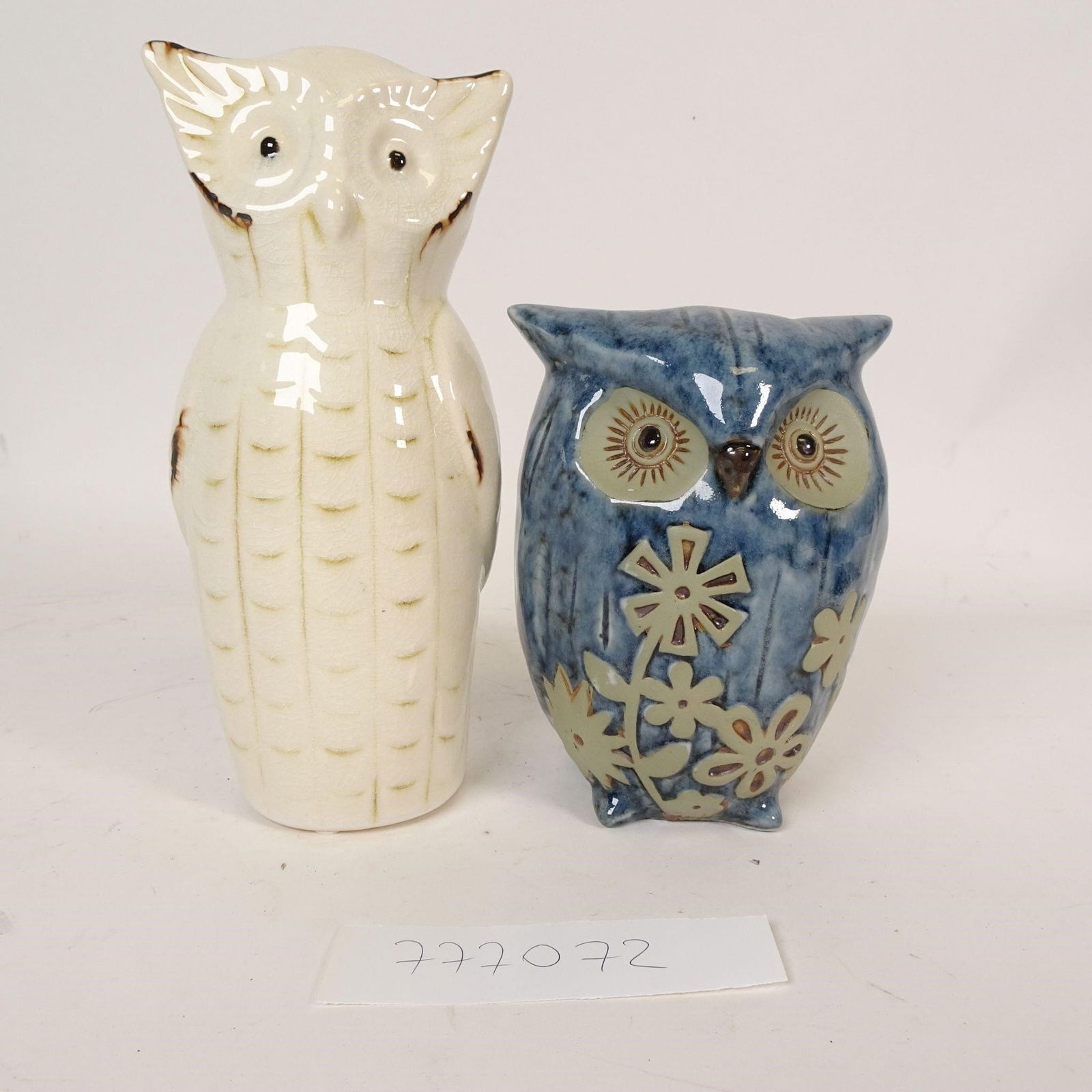 Vintage Ceramic Owl Figurines: Charming set of two vintage ceramic owl figurines, beautifully hand-painted and glazed. Each owl features unique colors and detailing, making them a lovely decorative pair. One owl is finished in a cr